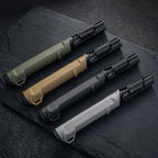 Outdoor ignition tools on a dark charcoal outdoor gear surface