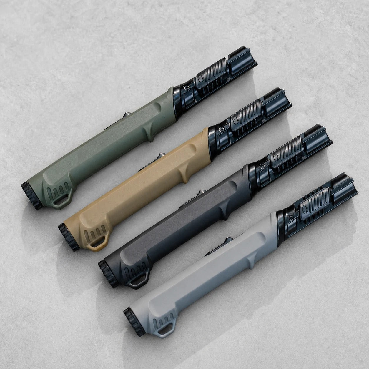 Outdoor ignition tools in multiple colors on a clean grey studio background